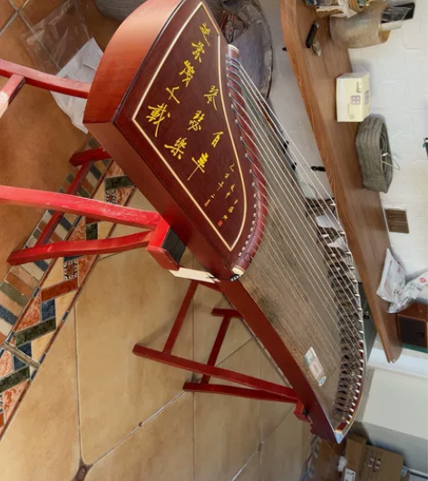 实体店买的龙凤牌古筝,原价4000左右,买...