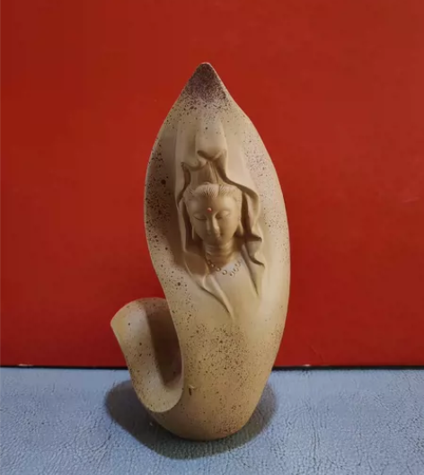 紫砂观音摆件。那年,我和明友去北京举办的茶...